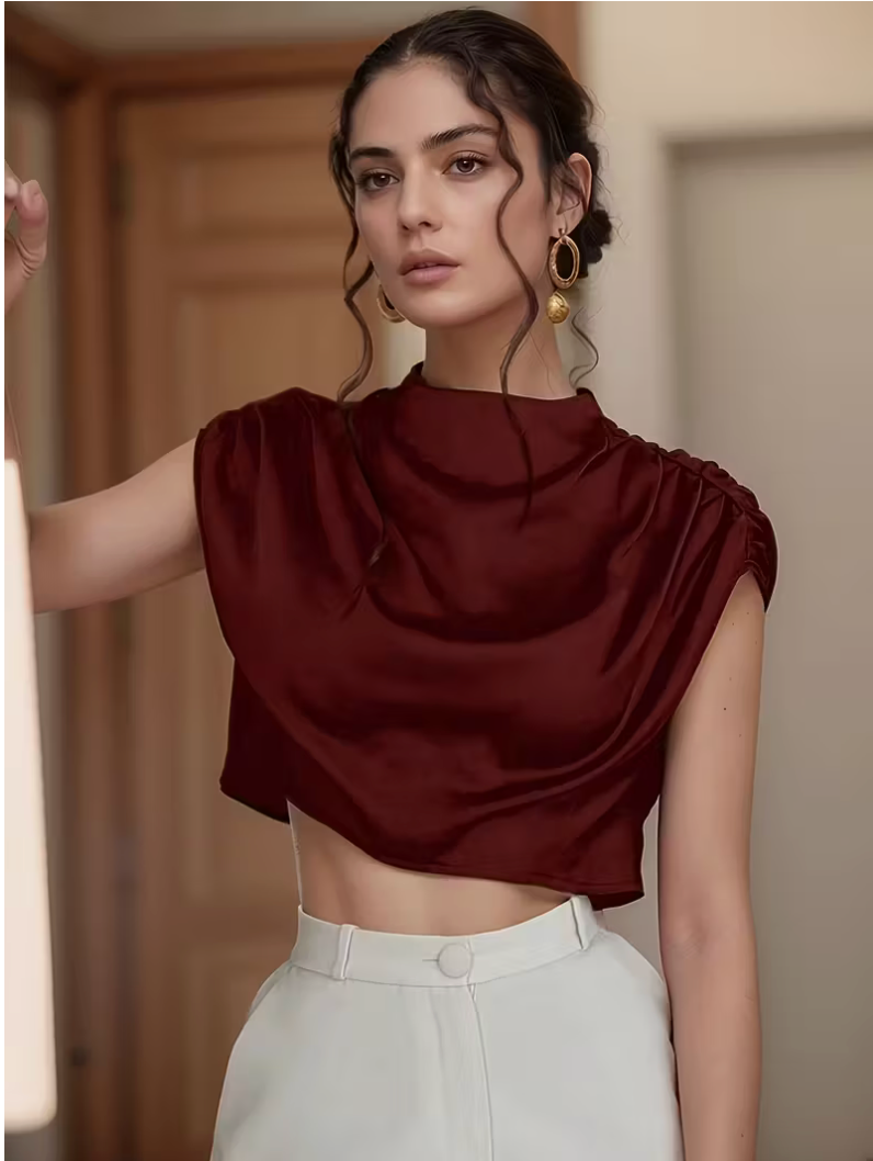 Womens solid color pleated batwing sleeve shirt featuring an