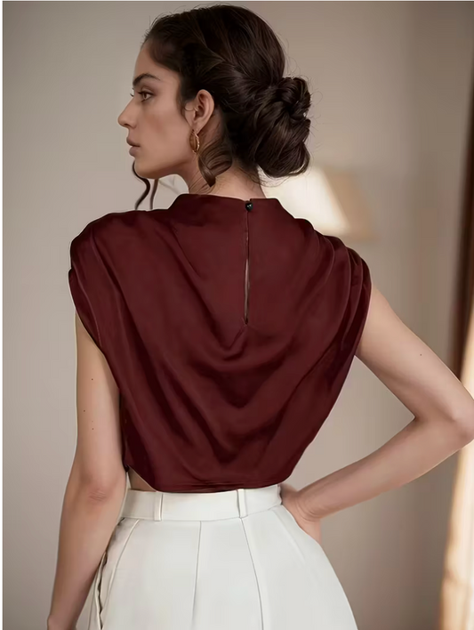 Womens solid color pleated batwing sleeve shirt featuring an