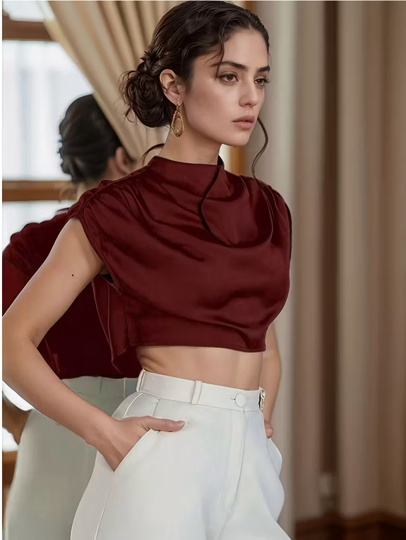 Womens solid color pleated batwing sleeve shirt featuring an