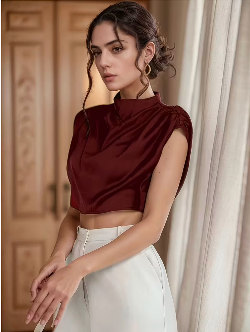 Womens solid color pleated batwing sleeve shirt featuring an